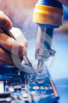 IT man repairing CPU board of a computer