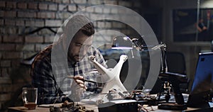 Man repairing a drone