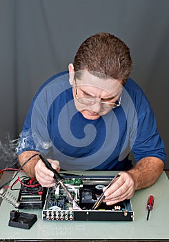 The man repairing DVD a player