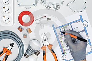 Man repairing electrical system in house or office.