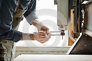 Man Repairing Machine