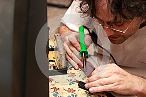 Man repairing television