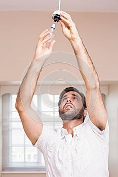 Man replacing the light bulb