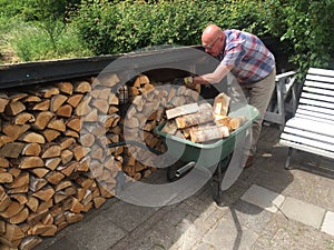 Man replenish fire wood