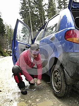 Man resolving a tyre puncture photo