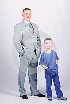 Man respectable businessman and little kid doctor uniform. Family business. Doctor respectable career. Dad boss. Father