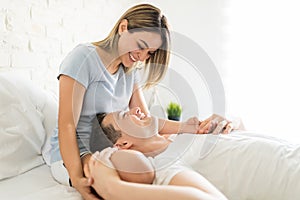 Man Resting On Beautiful Woman`s Lap In Bedroom