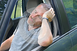 Man is resting in the car