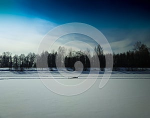 Man resting on frozen river landscape background