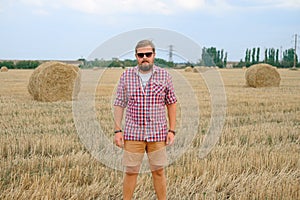 Man resting after hay in haystacks photo