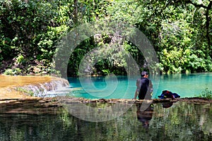 Man resting by the Semuc Champey natural monument in Guatemala