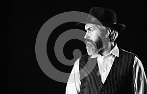 Man with retro Hat. brutal bearded hipster in suit vest. mafia gentlemen club. mature cowboy. detective acknowledgement