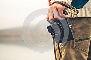 Man with retro photo camera Fashion Travel Lifestyle