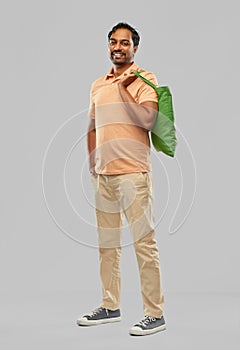 Man with reusable canvas bag for food shopping