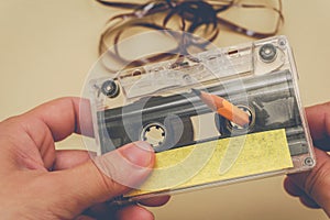 Man rewind a cassette tape