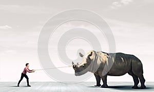 Man and rhino