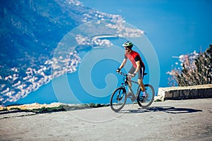 Man ride mountain bike on the road.