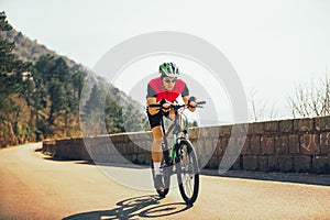 Man ride mountain bike on the road.