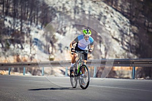 Man ride mountain bike on the road.