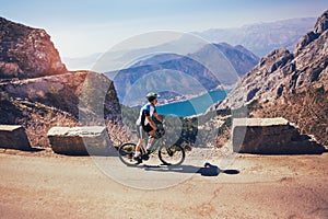 Man ride mountain bike on the road.