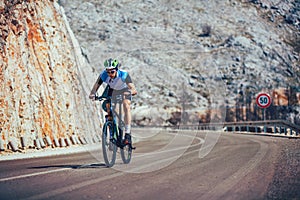 Man ride mountain bike on the road.