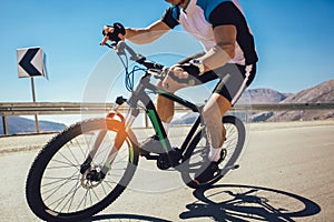 Man ride mountain bike on the road.