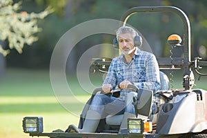 man on rideon mower