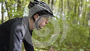 Man rides bicycle in the forest