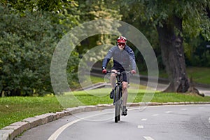 Man riding on bicycle on a bike path in the city.