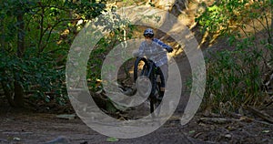 Man riding bicycle in forest 4k