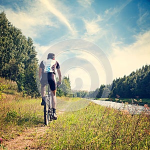 Man Riding a Bicycle on Nature Background