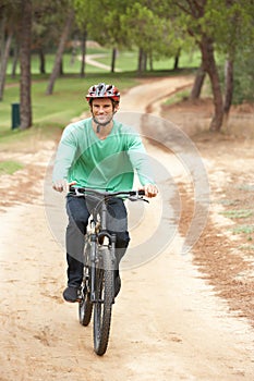 Man riding bicycle in park