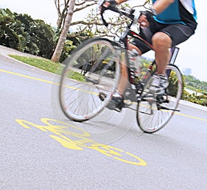 Man riding a bicycle in the park, selective Focus