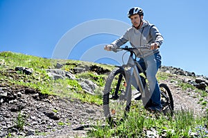 Man Riding Electric Mountain Bike