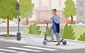 Man riding electric scooter, standing on pedestrian crosswalk with traffic light