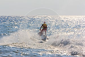 Man riding a hydrocycle in the sea