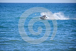 Man riding a jet ski on a sunny day