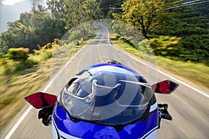 Man riding motorcycle with motion blur