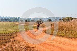 Man riding a mountain bike on a dirt road