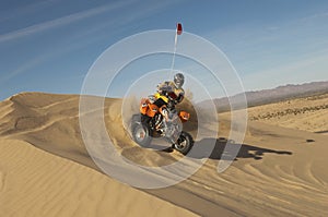 Man Riding Quad Bike In Desert