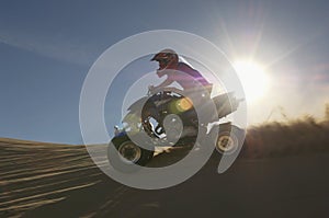 Man Riding Quadbike In Desert