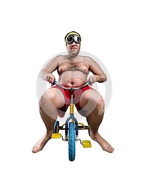 Man riding a small bicycle