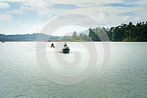 Man riding speed boat at Lake Kenyir malaysia