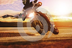 Man riding sport motorcycle on asphalt highway