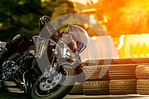 Man riding sport motorcycle on racing track