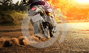 Man riding sport touring motorcycle on dirt field photo