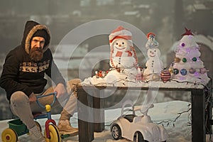 Man riding tricycle on snow