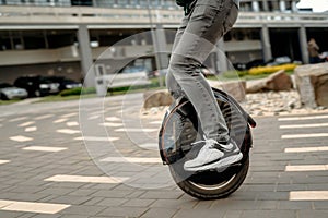 Man riding unicycle on street