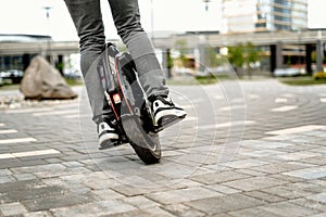 Man riding unicycle on street