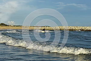 A man riding a water scooter Summer vacation in the tropical sea The hobby of a young man riding the sea